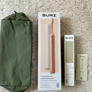 Electric Toothbrush with Green carrying case. Brand new. Closed and seal.